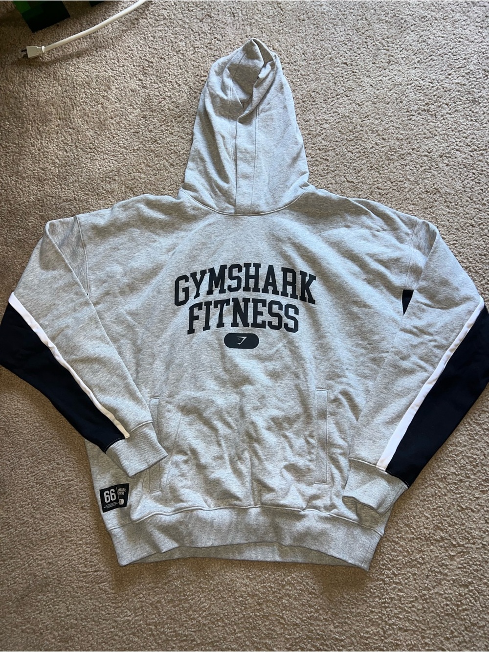 Gymshark Men's Light Gray Hoodie with Navy and White Sleeve Panels